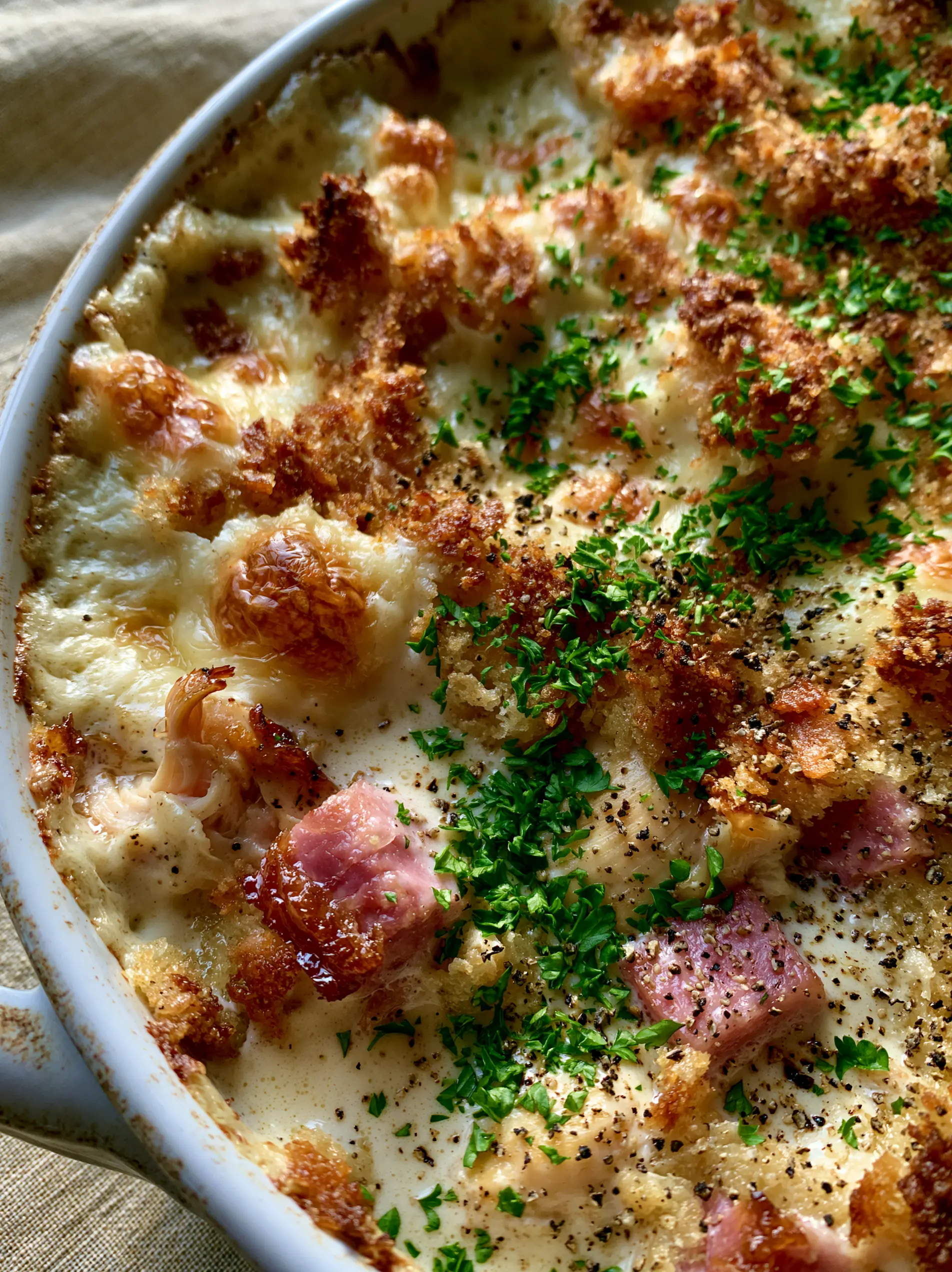 Chicken Cordon Bleu Casserole with Golden Panko and Bubbling Swiss 3 Macro overhead shot of Chicken Cordon Bleu Casserole showing bubbling Swiss cheese and toasted panko crust.