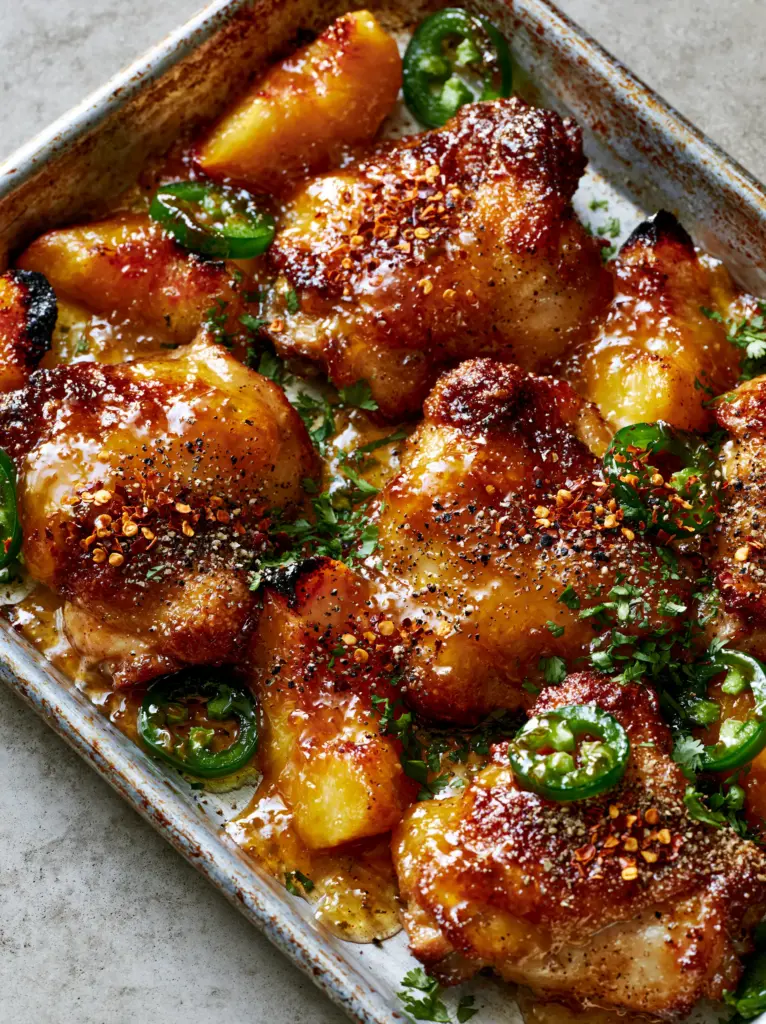Jalapeño Peach Chicken: The Ultimate Sweet and Spicy Sheet Pan Dinner 1 Close-up of blistered jalapeños and caramelized peach edges interspersed with seared chicken. (Jalapeño Peach Chicken)