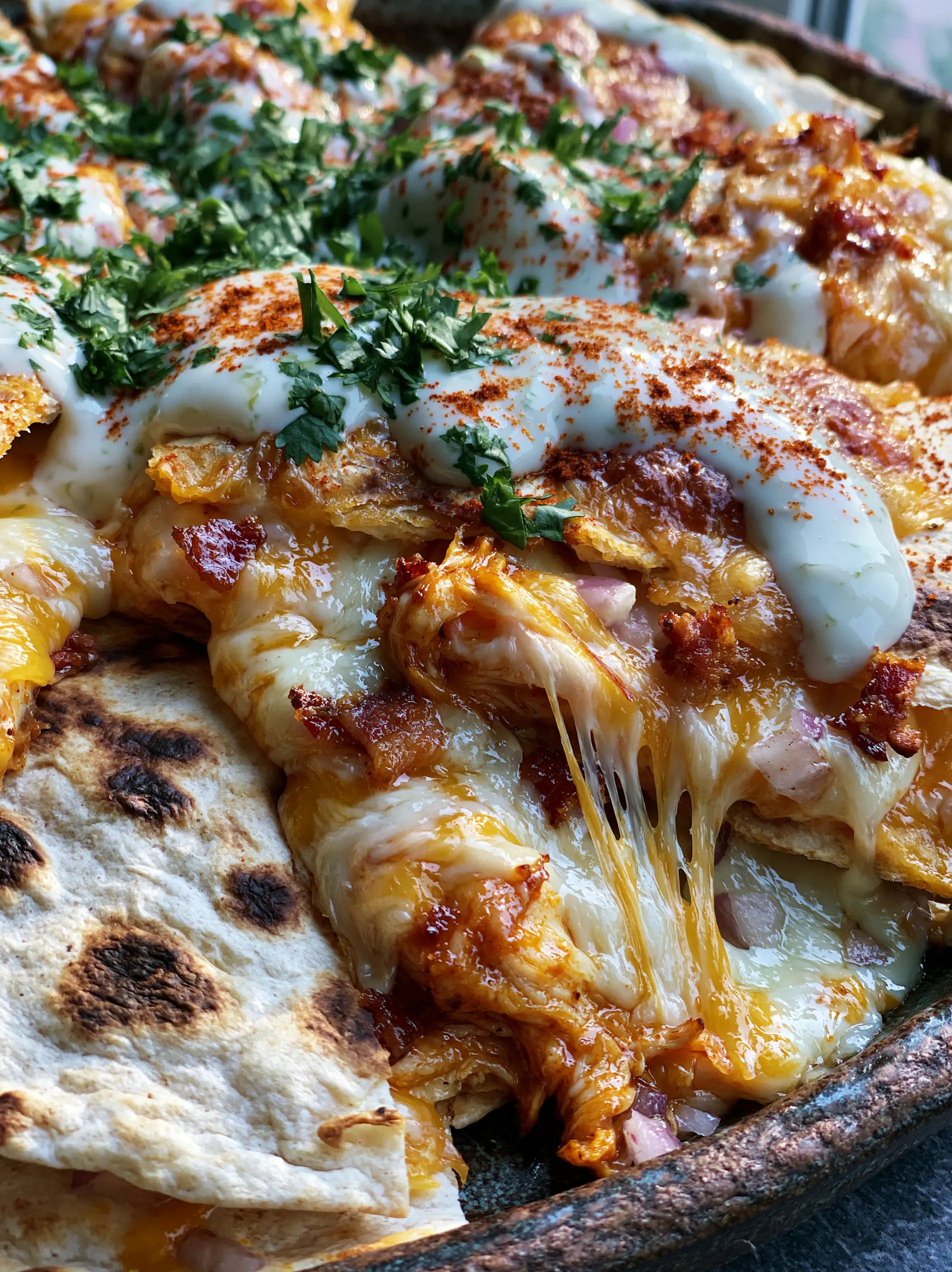 Back To School Dinner Ideas: Crispy Sheet-Pan Chicken Bacon Quesadillas 3 Extreme close-up of a chicken quesadilla with melted monterey jack cheese pulls and charred flour tortilla spots. (back to school dinner ideas)