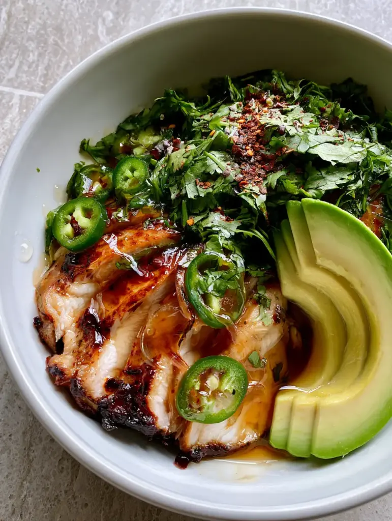 Honey Lime Chicken Avocado: The Ultimate 20-Minute Pan-Seared Dinner 2 A close-up handheld photo of honey lime chicken avocado with caramelized edges and fresh jalapeños.